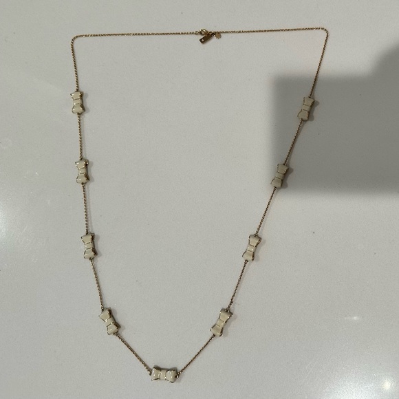 Kate Spade New York Take a Bow Gold and White Enamel Bow Scatter Chain Necklace - Picture 4 of 9
